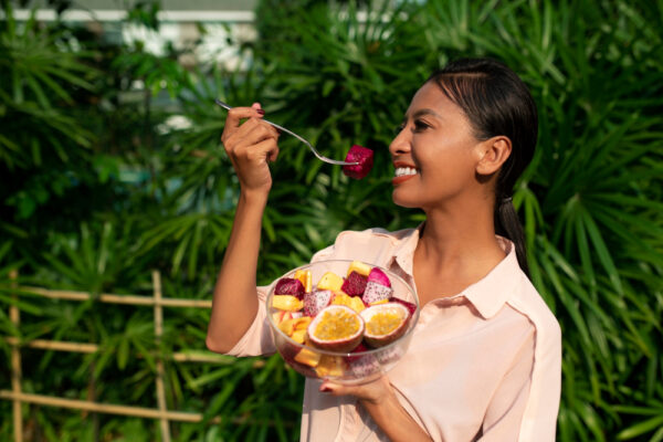 woman-outdoors-with-dragon-fruit